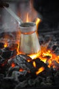 Making coffee in the Cezve on the coals Royalty Free Stock Photo