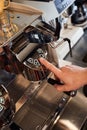 Worker start work of coffee roaster Royalty Free Stock Photo