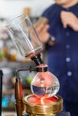 Making coffee with syphon method