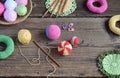 Making colored crochet balls. Toy for babies and toddlers to learn mechanical skills and colors. On the table threads, needles, Royalty Free Stock Photo