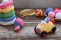 Making colored crochet racing car. Toy for babies and toddlers to learn mechanical skills and colors. On the table threads, Royalty Free Stock Photo