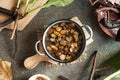 Making comfrey root ointment using melted rendered pork lard