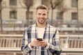 Making communication easier. Happy guy use smartphone outdoors. Mobile communication. Conversation and chat. Using Royalty Free Stock Photo