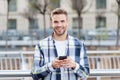 Making communication easier. Happy guy use smartphone outdoors. Mobile communication. Conversation and chat. Using Royalty Free Stock Photo