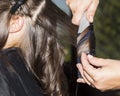 Making curles with hair iron at the hairdressers Royalty Free Stock Photo