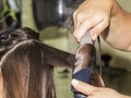 Making curles with hair iron at the hairdressers Royalty Free Stock Photo