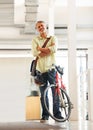 Making the days deliveries. Full length shot of a handsome bike messenger in an office.