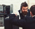 Making a deal. Company manager and man have business meeting. Customer hold briefcase. Bearded man listen to customer
