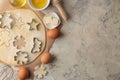 Making delicious cookies. Cookie cutters. Dough for baking. Ingredients for the dough, eggs, flour, butter, sugar on a light backg Royalty Free Stock Photo