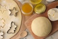 Making delicious cookies. Cookie cutters. Dough for baking. Ingredients for the dough, eggs, flour, butter, sugar on a light backg Royalty Free Stock Photo