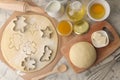 Making delicious cookies. Cookie cutters. Dough for baking. Ingredients for the dough, eggs, flour, butter, sugar on a light backg Royalty Free Stock Photo