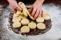 Making donuts from raw yeast dough Royalty Free Stock Photo