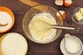 Making dough for baking from fresh ingredients on rustic wooden table Royalty Free Stock Photo