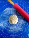 Making a dough for cookies on a silicone bedding with silicone rolling pin