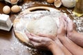 Making dough from eggs and milk. Heart shaped dough with female and child hands. Cooking and home concept Royalty Free Stock Photo