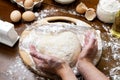 Making dough from eggs and milk. Heart shaped dough with female and child hands. Cooking and home concept Royalty Free Stock Photo