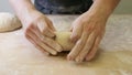 Making dough by male hands at bakery