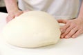 Making dough by male hands at bakery