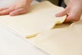 Making dough by male hands at bakery