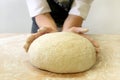 Making dough by male hands at bakery