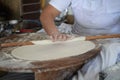 Making dough for pizza at home. kneading, rolling, female hands in the frame. Preparation of dough, kneading