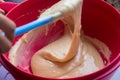 Making dough in red bowl