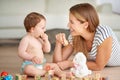 Making early childhood experiences fun and entertaining. Shot of an adorable baby girl and her mother playing with Royalty Free Stock Photo