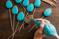 Making easter blue cake pops. Culinary decor. Royalty Free Stock Photo