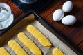 Making eclairs. Homemade Eclair. Series. Transferred on a baking sheet.