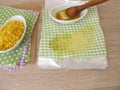 Making of ecological plastic-free beeswax cotton wraps Royalty Free Stock Photo