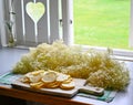 making elderflower lemonade with lemons in kitchen