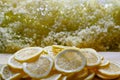 making elderflower lemonade with lemons in kitchen