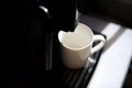 Empty white cup in coffee machine Royalty Free Stock Photo