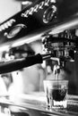 Making espresso coffee close up detail with modern machine Royalty Free Stock Photo