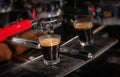 Making espresso in white mug in coffeeshop or cafe closeup