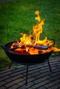 Making a fire in a fire bowl with burning wood Royalty Free Stock Photo