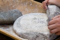 Making flour in a traditional way for the Neolithic era