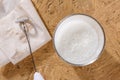 Milk and milk frother Royalty Free Stock Photo