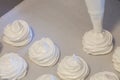 Making French meringue cookies on parchment paper