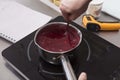 Making fruit jelly on an induction cooker Royalty Free Stock Photo