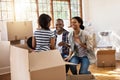 Making fun memories in their new home. a family having fun while moving house. Royalty Free Stock Photo