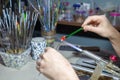 Making a glass bead on a gas burner Royalty Free Stock Photo