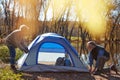 Making the great outdoors their home for the weekend. a senior couple setting up a tent while camping in the wilderness. Royalty Free Stock Photo