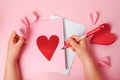 Making of handmade Valentine greeting card. Children's DIY, hobby concept, Valentine's Day letter