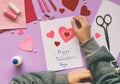 Making of handmade Valentine greeting card from felt. Children`s DIY, hobby concept, gift with your own hands. Valentine`s Day