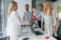 Making handshake. Group of professional business people is in the office Royalty Free Stock Photo