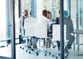 Making headway with their meeting. a team of professionals having a meeting in the boardroom at work.