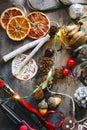 Making home made garlad from natural materials - dry orange chips, ginger bread cookies, arcons, ribbons, cinnamon Royalty Free Stock Photo