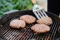 Making homemade burgers on grill