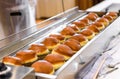 Making homemade jam doughnuts in a professional restaurant buff Royalty Free Stock Photo